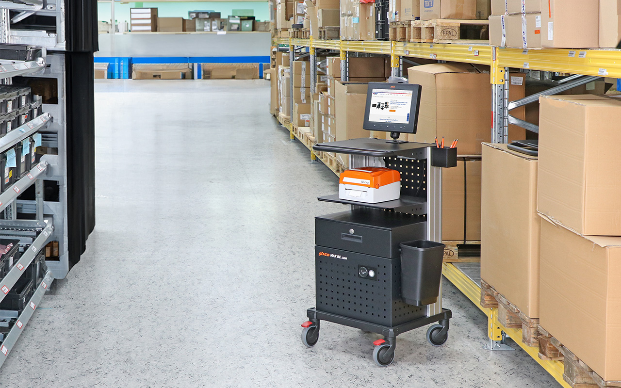 MAX BE STD mobile workstation with terminal and printer and other accessories used in the warehouse
